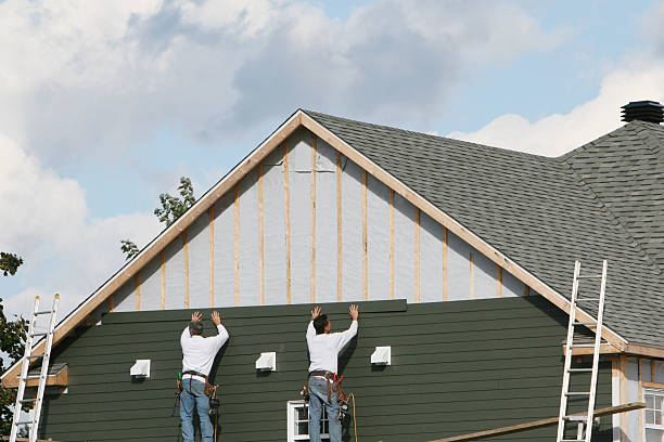 Professional Vinyl Siding technician working in Clymer, PA